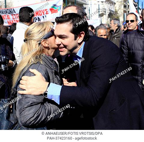 Alexis Tsipras of the Coalition of the Radical Left - Unitary Social Front (SYRIZA) greets a woman during a general strike in Athens, Greece, 20 February 2013