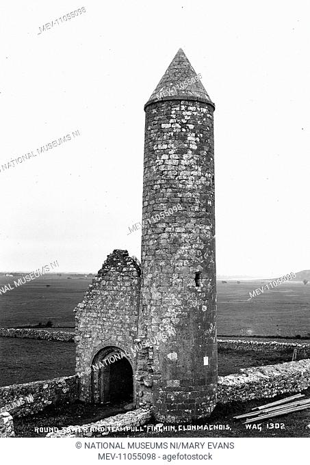 Round Tower and Teampull, Finghin, Clonmacnois - a view of a round tower intact and building to the left side. (Location: Republic of Ireland: County Offaly:...