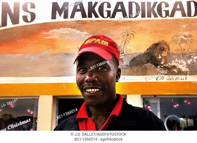 Man in a gas station with a cap of Spain (winner of the South Africa 2010 FIFA World Cup), Gweta, Botswana