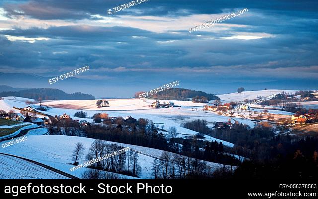 landscape with solitude farm in the hills of lower austria in winter
