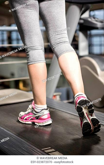 Lower section of a woman on a treadmill