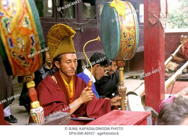 lama playing the drum at ladakh festival ; leh ; jammu & kashmir ; india
