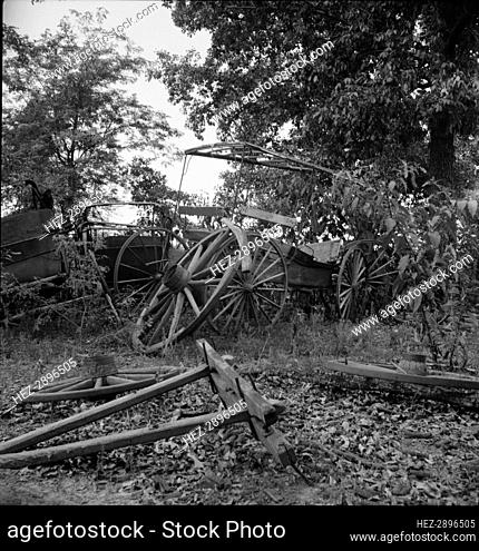 Abandoned coaches and wagons..old blacksmith shop, Wray Plantation, Greene County, Georgia, 1937. Creator: Dorothea Lange