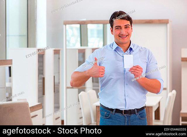 Salesman assistant in furniture shop