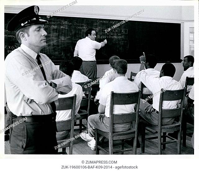 1972 - Sing Sing convicts trained in Computer skills: Correction Officer Joseph D. Cassidy, Left, stands guard as convict Bernie W