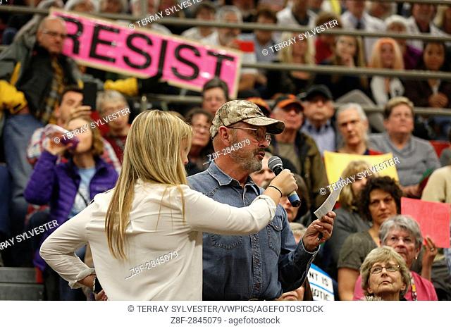 A man questions U. S. Rep. Greg Walden (R-OR) during a constituent town hall meeting on April 13, 2017. Bend, Oregon, United States