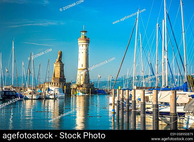 Harbour entrance of Lindau, Lake Constance - Bodensee - with the new lighthouse and the Bavarian Lion. The Lindau lighthouse is the southernmost lighthouse in...