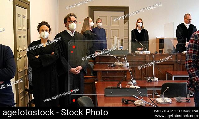 12 April 2021, Hamburg: The accused sits behind his defence lawyers Fenna Busmann (l) and Florian Melloh in the courtroom at the Criminal Justice Building at...
