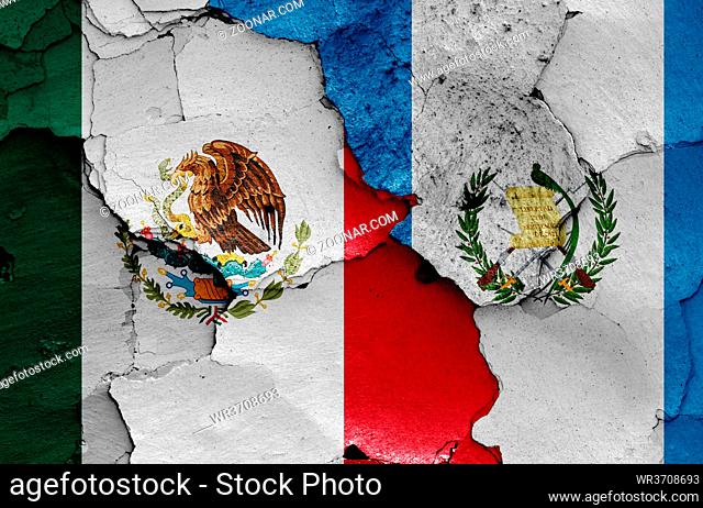 flags of Mexico and Guatemala painted on cracked wall