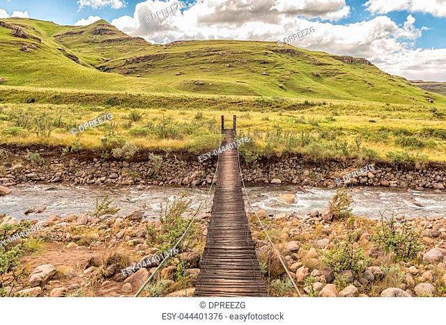 Pedestrian bridge over the Mlambonja River at the start of the Three Pools hiking trail at Garden Castle in the Drakensberg