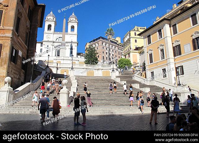 18 July 2020, Italy, Rom: Few people stand at the Spanish Steps in Rome. The number of foreign tourists in Italy's capital is extremely low due to the Corona...