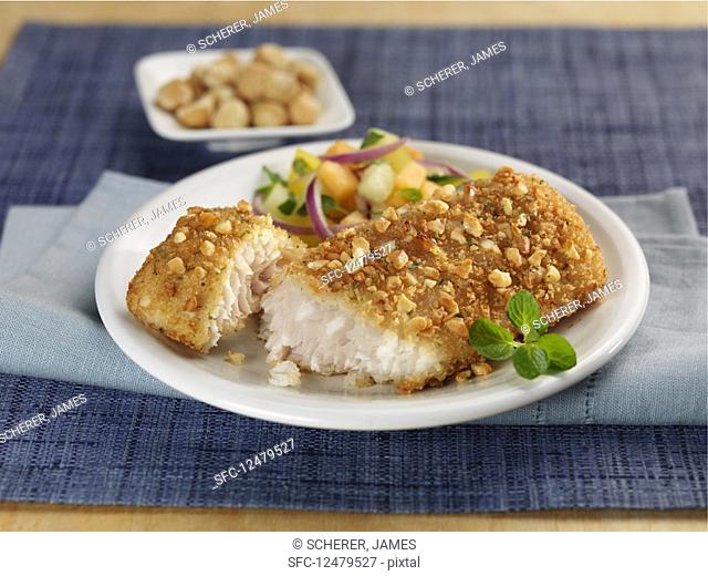 A gold mackerel fillet coated in a macademia crust
