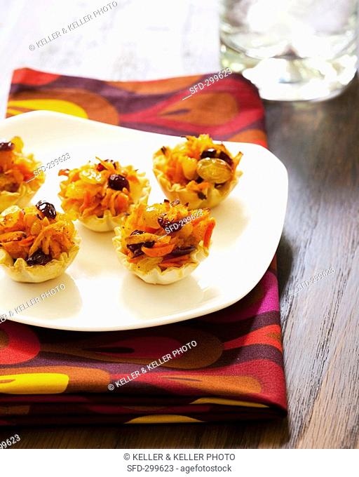 Root vegetables and fruit in filo pastry shells