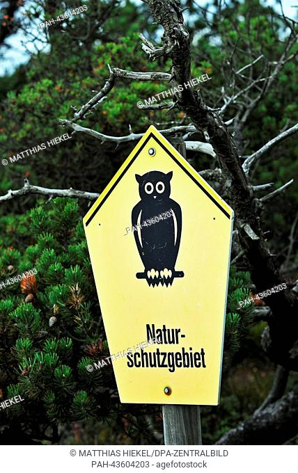 A sign reading 'Nature Reserve' stands on the ridge of the Eastern Ore Mountains in the raised hog 'Georgenfelder Hochmoor' at the German-Czech border near...