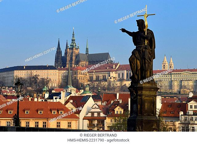 Czech Republic, Prague, historical centre listed as World Heritage by UNESCO, statue of John the Baptist on Charles Bridge (Karluv Most) with the royal castle...