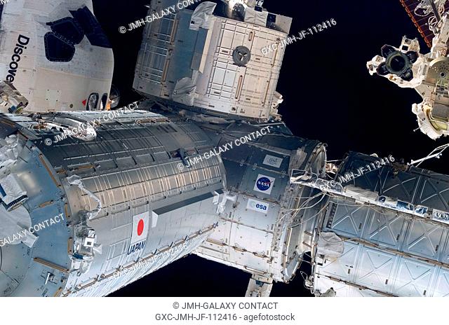 Backdropped by the blackness of space, the Japanese Pressurized Module (left), the Japanese Logistics Module (top center), the Harmony node (center)