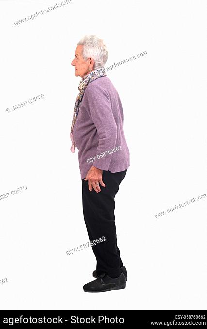 full portrait of a senior woman in profile on white background