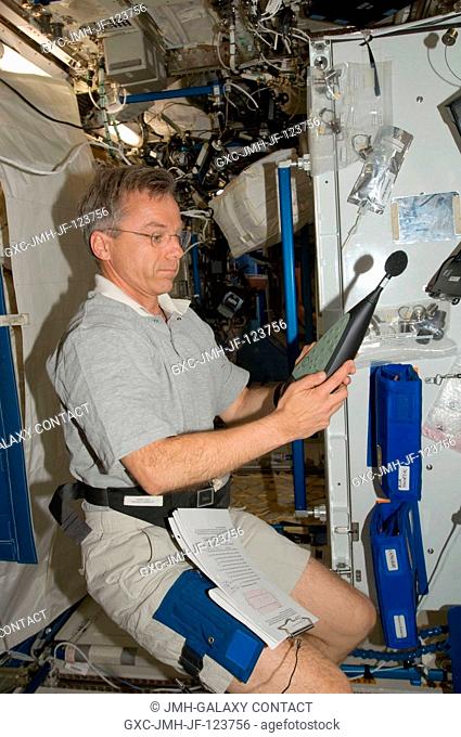 Canadian Space Agency astronaut Robert Thirsk, Expedition 20 flight engineer, works with a U.S. Sound Level Meter (SLM) for Setup and Acoustic Survey in the...