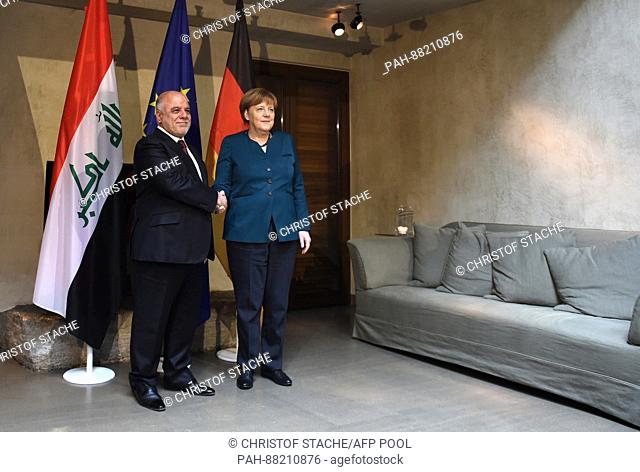 German Chancellor Angela Merkel (R) and the Iraqi head of state Haider al-Abadi before a meeting at the security conference in Munich, Germany, 18 February 2017