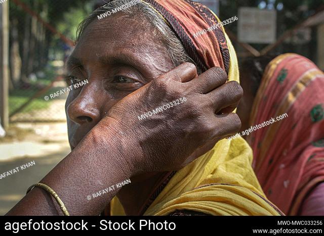 Portrait of a worried old female worker. Bangladesh tea workers union have been staging protests, human chains, demonstrations and a two-hour strike every day...