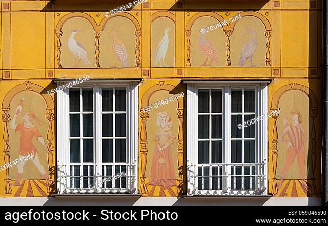 Windows with decorations on the wall of renovated old tenement house in Gdansk Old Town, Poland