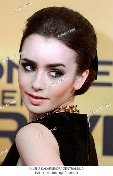 Actress Lily Collins arrives at the premiere of her film 'The Mortal Instruments - City of Bones' at Cinestar Cinema at Potsdamer Platz in Berlin, Germany