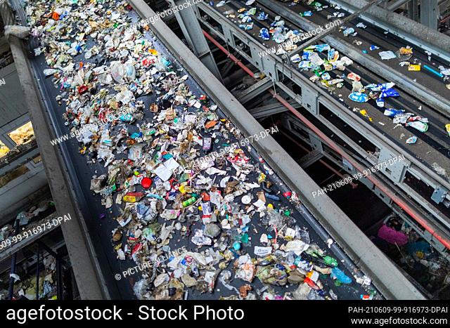 08 June 2021, North Rhine-Westphalia, Erftstadt: Different packaging waste (PET, PE, PP, PS) is separated in a sorting plant of the waste management company...