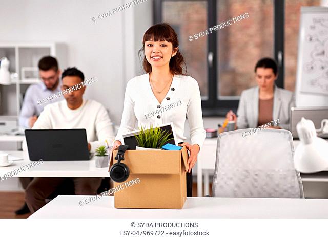 female employee with personal stuff at office