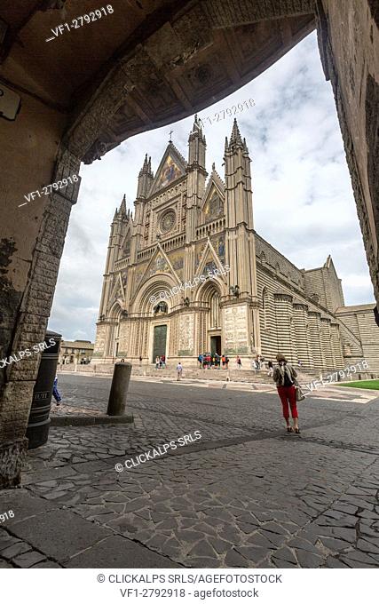 View of the gothic cathedral with golden mosaics and bronze doors Orvieto Terni Province Umbria Italy Europe