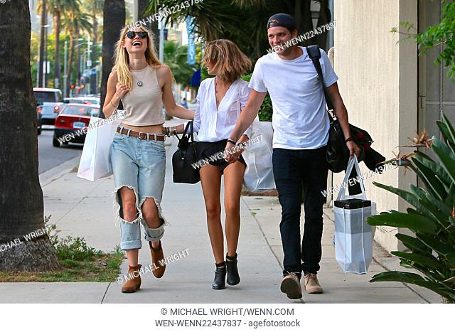Sarah Hyland, Dominic Sherwood and Lucy Fry out and about in Los Angeles. Sarah wearing a Merritt Charles top and shorts and accenting the outfit with jewelry...
