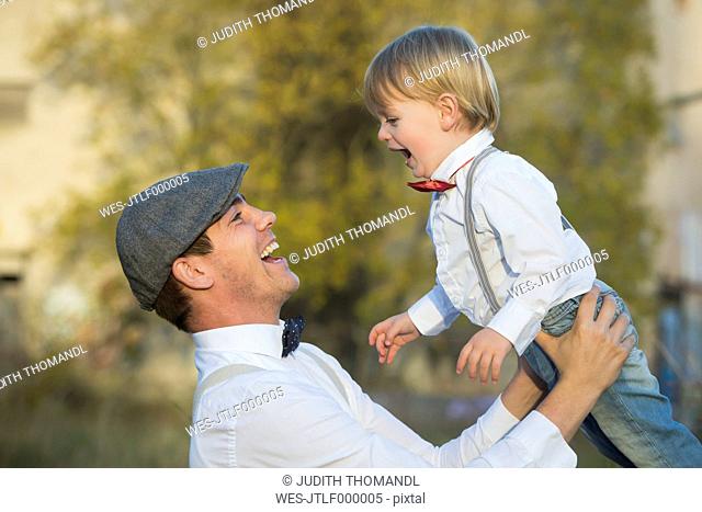 Happy father and son outdoors