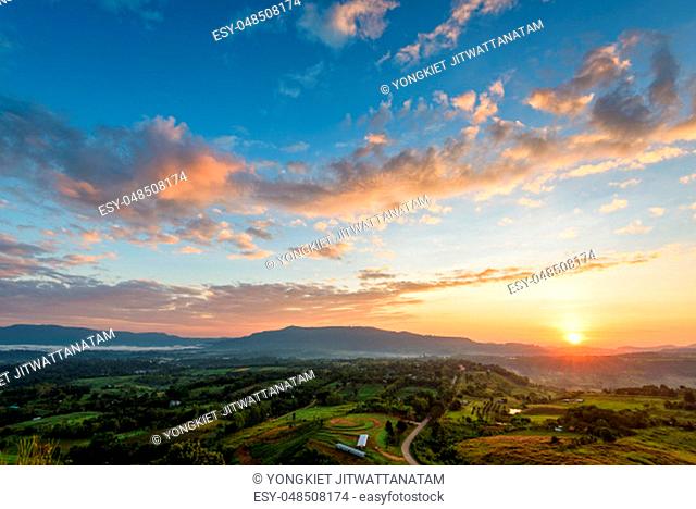 Beautiful nature landscape of the colorful sky and mountains during the sunrise at Khao Takhian Ngo View Point, Khao Kho attractions in Phetchabun, Thailand
