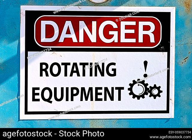 Closeup of a Danger Rotating Equipment sign