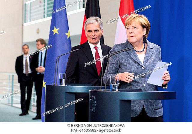 German Chancellor Angela Merkel (CDU, R) and her Austrian counterpart Werner Faymann arrive at a joint press conference on the future course of action of both...