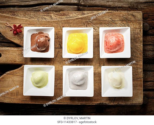 Six different flavours of ice cream: chocolate, pineapple, strawberry, pistachio, coconut and vanilla