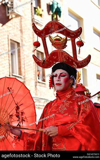 January, 22, 2023, Madrid, Spain, woman putting on makeup to parade as a geisha. celebration in Madrid of the Chinese New Year