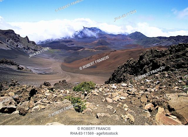 Cinder cone and iron-rich lava weathered to brown oxide in the crater of Haleakala, the world's largest dormant volcano, island of Maui, Hawaii