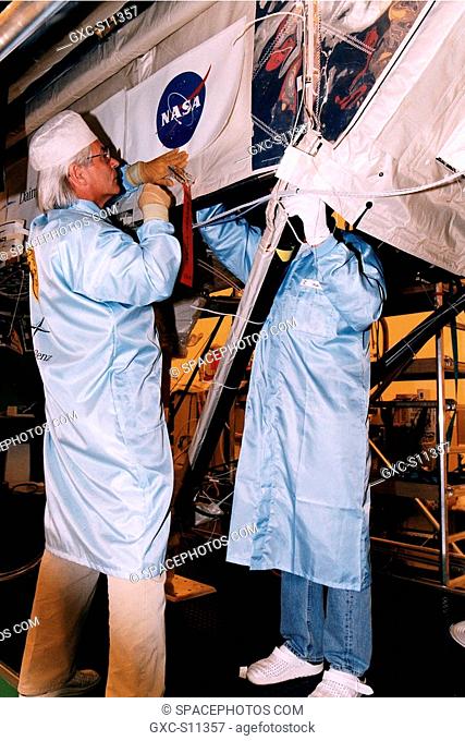 05/06/1997 --- Employees of Daimler-Benz Aerospace in the Multi-Payload Processing Facility install insulation on the Cryogenic Infrared Spectro-meters and...