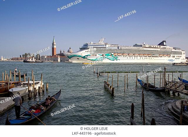 Gondolas and cruise ship Norwegian Jade (Norwegian Cruise Line) in Bacino di San Marco with Isola di San Maggiore island in distance, Venice, Veneto, Italy