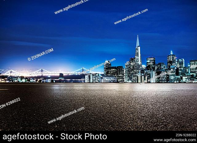 empty asphalt road with cityscape and skyline of san francisco at twilight