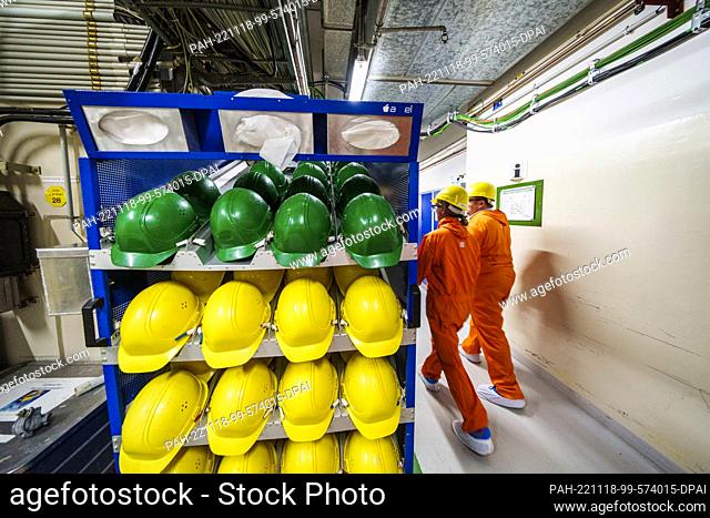 18 November 2022, Hessen, Biblis: Safety helmets lie ready on a shelf. The Biblis nuclear power plant has been undergoing decommissioning since it was shut down