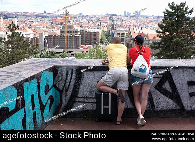 06 June 2022, Czech Republic, Prag: Tourists stand in Letna Park and look at the Old Town of Prague. Photo: Sebastian Kahnert/dpa