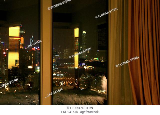 Curtain at the window of a hotel room, view at the city at night, L'Hotel hotel, Hong Kong, China, Asia