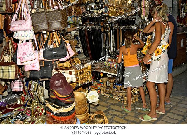Visitors shop souvenir stalls Sousse Medina Tunisia