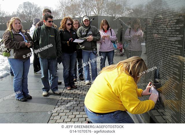 Washington DC, National Mall and Memorial Parks, Vietnam Veterans Memorial Wall, Vietnam War, monument, architect Maya Lin  pencil rubbing, killed soldier