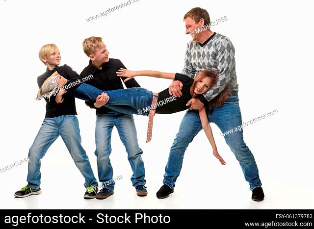 Dad and sons stretch sister by the arms and legs, white background