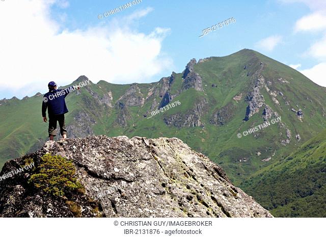 Young hiker in Fontaine Salee reserve, Auvergne Volcanoes Natural Regional Park, massif of Sancy, Puy de Dome, Auvergne, France, Europe