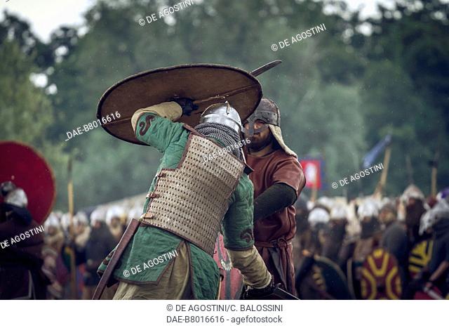 Warriors in battle with swords and shields, lamellar armour, Slavic and Viking Festival, Centre of Slavs and Vikings, Jomsborg-Vineta, Wolin island, Poland