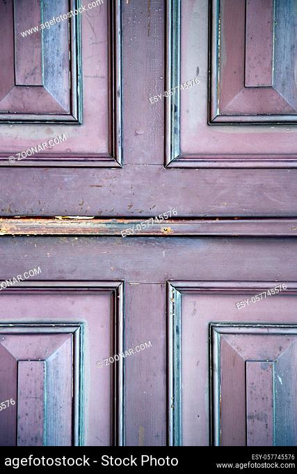 abstract samarate  rusty brass brown knocker in a door curch closed wood lombardy italy varese