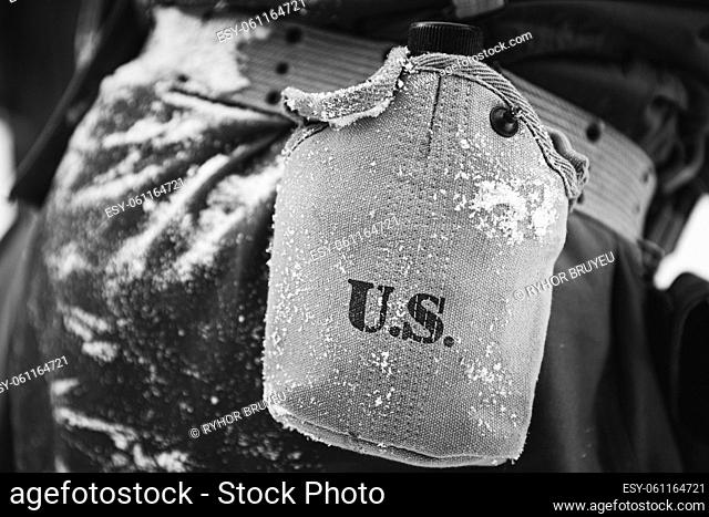 American Military Ammunition Of A US Soldier At World War II. Warm Autumn Clothes, Flask. Photo In Black And White Colors
